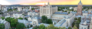 Sprawling aerial view of Central Campus's gothic architecture at sunset